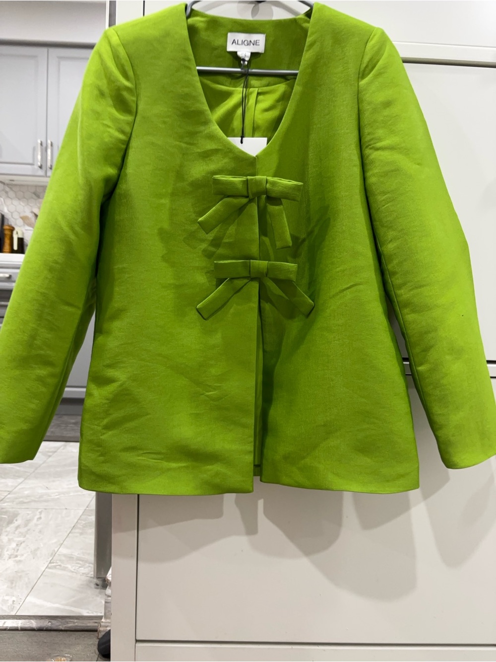 ALIGNE Beau Blazer featuring a V-neckline and decorative bow